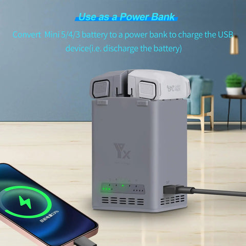 Dual Battery Charging Hub For DJI Mavic Mini Series 5 Pro 4 Pro 3 Pro connected to a phone via USB, used as power bank