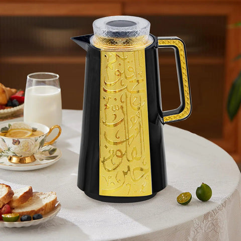 Arabic And Turkish Style Insulated Coffee Carafe 33 Oz Vacuum Thermal Bottle Keeps Drinks Hot Or Cold Tea Water Coffee Dispenser With Push Button Lid Black And Gold For Housewarming Or Everyday Use on a table