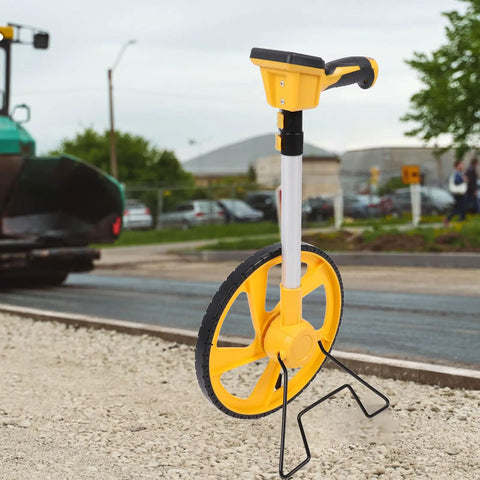 Digital Measuring Wheel for Versatile Professionals with yellow wheel and handle, adjustable length for accurate measurements.