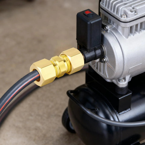 Brass 3/4 in OD compression straight union connector installed on air compressor
