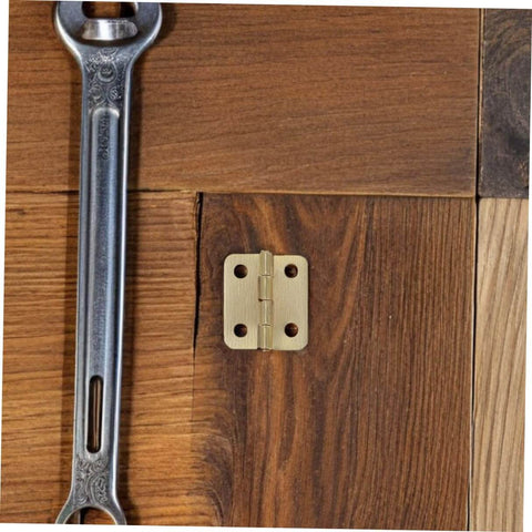40 Pcs Mini Iron Hinge Set With Screws For Jewelry Boxes And Tiny Chests 270 Degree Rotation Small Wooden Box Hinges shown on wood