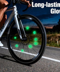 Cyclist on road with 36 Pack Glow In The Dark Luminous Bicycle Wheel Spoke Wrap Tubes in colorful plastic on front wheel.