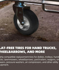 Flat-free solid rubber tire for hand trucks, wheelbarrow visible beside metal frame, installed view, used on various equipment