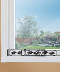 Sliding Glass Window Security Bar Set Of 2 Adjustable Size Black Extra Home Security Beyond Locks Durable Iron Construction Easy To Install Decorative Leaf Pattern For Maximum Window Protection in a window installation view