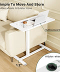 Mobile Standing Desk With Pneumatic Height Adjustment next to couch, showing multifunctional slot and hidden wheels.