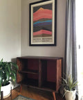 Mid-century modern cabinet with round solid wood furniture legs in a living room setting