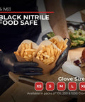 Large black nitrile food safe gloves holding fries, showcasing Super Strong Black Nitrile Gloves 1000 Count.