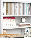Slick 7 Tier Metal Bookcase 71 Inch White With Doors Industrial Display Shelf Unit filled with books and decor
