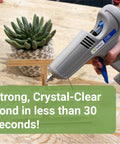Using Crystal Clear Hot Glue Sticks 4 Inch 0.44 Inch Diameter 50 Pieces for crafting with glue gun on a wooden surface.