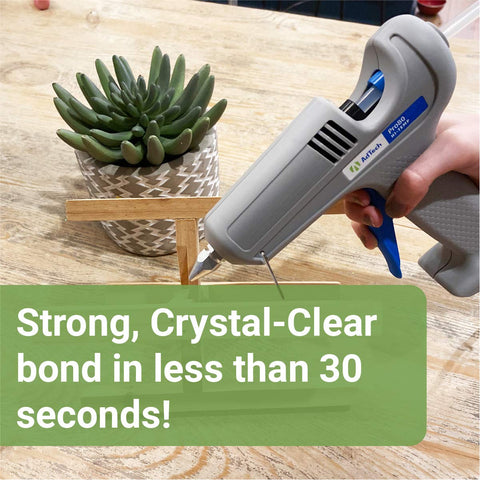 Using Crystal Clear Hot Glue Sticks 4 Inch 0.44 Inch Diameter 50 Pieces for crafting with glue gun on a wooden surface.