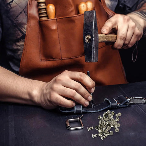 Tough Stainless Chicago Screws 110 Piece Kit, hammering screw into leather with fasteners and tools for crafting.