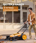 Man using Heavy Duty Manual Walk Behind Floor Sweeper With 41 Inch Wide Cleaning Path For Warehouses Non Electric Broom on sidewalk.