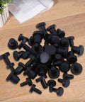 Cool 50 Pack Black Silicone Hole Plugs In 5 Sizes For Pipe And Bottle Ends Waterproof Flexible Rubber Stoppers That Fit Tight Without Leaking Any Liquid Or Mess Up Your Daily DIY Hacks At Home, assorted sizes on table