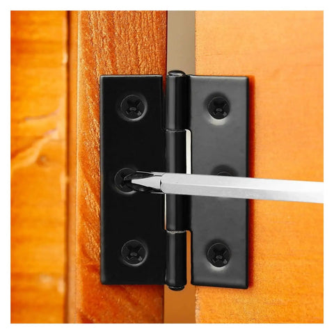 Close-up of black stainless steel rotating concealed hinge being installed on wooden cabinet with screwdriver.