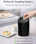 Hand using Tiny Matte Black Desktop Trash Can With Lid For Office Desk And Vanity 1.5 Liter Countertop Waste Bin