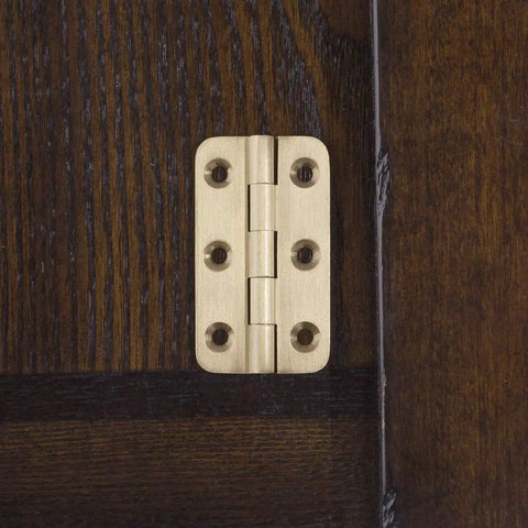 Built Tough 2 Inch Brushed Solid Brass Butt Hinges With Full Mounting Hardware For Heavy Lifting Door Installation Rust Resistant Smooth Swivel Action 4 Pack Set installed on dark wood.