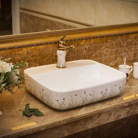 Ceramic Vessel Sink For Bathroom Vanity, Above Counter Rectangular Wash Basin Featuring Hand Painted Nordic Artistry on marble countertop.