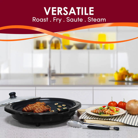 EMG 980BX Indoor Electric Round Nonstick Grill With Cool Touch Handle, grilling steaks, 14-inch size, on kitchen counter.