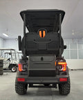 Four Seater Electric Golf Cart With 14 Inch Off Road Tires And MacPherson Strut Suspension, rear view showcasing cargo trunk and styling.