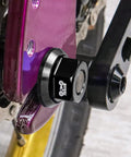 Close-up of Two Pack M9.5 Three Eighths Inch Bicycle Hub Flanged Axle Nuts Aluminum 7075 Alloy on bike, CNC machined