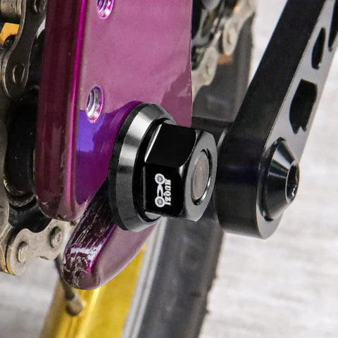 Close-up of Two Pack M9.5 Three Eighths Inch Bicycle Hub Flanged Axle Nuts Aluminum 7075 Alloy on bike, CNC machined