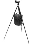 Carbon Fiber Travel Tripod With Pro Level Stability, Fast Setup And Takedown, Ergonomic Ball Head, Ultra Compact And Portable For Camera And Phone, 20 Pound Load Capacity supporting camera and bag.