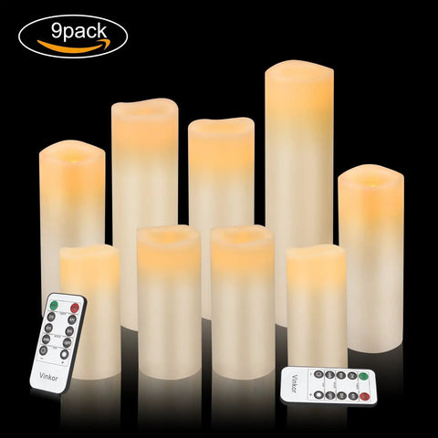 Nine-pack of flameless battery operated real wax pillar candles with 10 key remote and 24 hour cycling timer, ivory finish