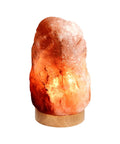 Natural Himalayan Salt Lamp With Wood Base And Dimmer Switch, Crystal Pink Rock, 5 To 7 Lbs on a wooden base emitting warm glow