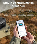 Person holding phone displaying app interface for SOLIX C800X Portable Power Station With 100W Solar Panel 1200W Peak Output