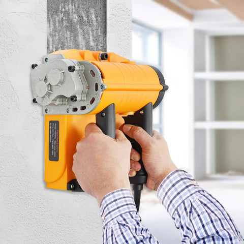Rugged Workhorse Electric Wall Planer And Handheld Power Scraper Featuring Quick Adjust Depth Dial For No Sweat Cleanup When Shaving Off Old Paint Or Stucco On Indoor Remodel Jobs in use on a textured wall.