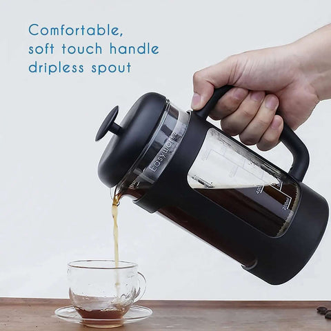 12 Oz French Press Coffee And Tea Maker With Borosilicate Glass Carafe And Soft Grip Handle No Fuss Four Level Filtration System Featuring Extra Fine Stainless Steel Mesh For Rich Smooth Brew At Home Or Office being poured into a cup