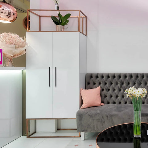 Stylish room with modern white cabinet featuring matte black 10 inch square cabinet pulls for kitchen cabinets and drawers.