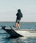 Man fishing on a boat equipped with Trolling Motor Stabilizer Mount For Terrova Riptide Ulterra PowerDrive.