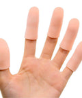 Hand wearing 12 Pack Gel Finger Cots For Pain Relief And Fingertip Protection, Silicone Finger Sleeves, Champagne Color