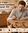 Man using Straight Up Tough Wood Repair Paste With Crack Lock Formula And Easy Glide Blend Sticks For No Stress Furniture Fixing And Lasting Surface Renewal Collection Kit on wooden table.