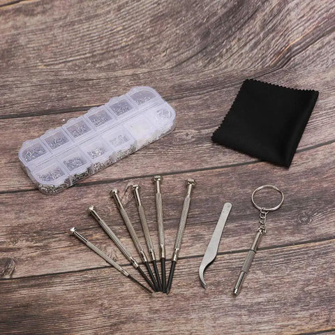 Eyeglass Repair Kit With Precision Screwdriver Set, Tweezers And Nose Pads, Multi Size Screws For Glasses Repair, on wood surface
