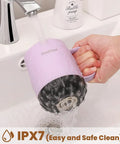 Total Game Changer For Your Morning Grind With This 12 Oz Self Heating Smart Mug washing under faucet for easy cleaning.
