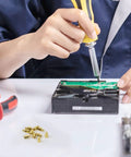 Technician using a screwdriver on a circuit board with Hardcore Heavy Duty M3 Hex Brass Standoff Spacers 10 Piece Set in view.