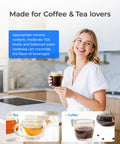 Image of woman holding coffee, showcasing Ten Cup Water Filter Pitcher Bundled With Three NSF Certified Cartridges For Straight Up Clean Hydration And No Nonsense Flavor That Hits Different Every Time You Sip.