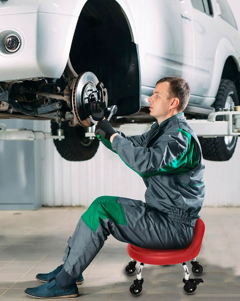Mechanic using Rolling Stool With Backrest 450 Lbs Weight Capacity PU Leather Seat All-Day Comfort Heavy-Duty Crystal Wheels in garage