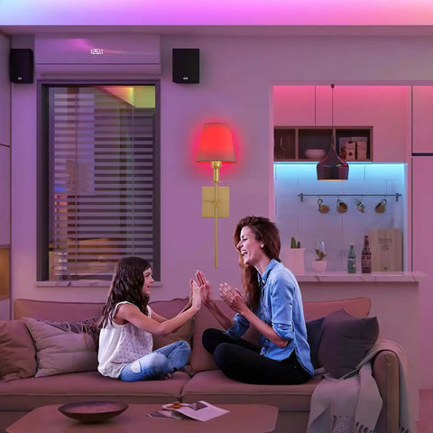 Living room with Wireless Battery Operated Wall Sconce Set Of 2 With Remote, gold finish, emitting soft LED light.