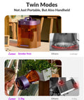 Person using a Lumos Portable Laser Engraver With 3W IR And 10W Diode Built In 50MP Camera For Color Marking On Metal Ultra Fast 4000mm Per Second Galvo Engraving Auto And Manual Focus Dual Laser Machine For Jewelry DIY Crafts And Fairs, handheld mode shown next to a potted plant.