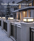 Hella Stylish Modern 15.75 Inch Flat Surface Pillar Lights For Outdoor Porch Deck Post With Romantic Soft Candle Glow, snow-covered fence lanterns.