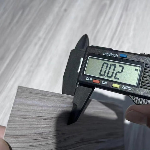 Real Wood Look Vinyl Floor Roll Featuring Dead Simple Peel And Stick Setup Super Wide Layout For Quick Room Makeovers Non Slip Grip and measuring thickness at 0.02 inches.