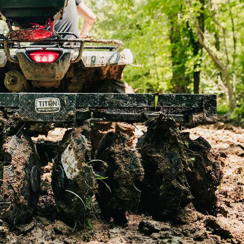 Tow Behind Notched Disc Harrow Attachment for ATV UTV 4 Ft Wide with 2 In Towball Hitch in action in muddy field
