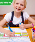 Child writing on Self Adhesive Primary Kid Friendly Desk Nameplates Pack Of 36 Featuring Manuscript Alphabet, 13.8 X 4 Inch plates