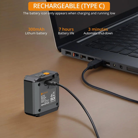 Heavy Duty Digital Angle Finder With LED Rechargeable Power charging via Type C cable next to a laptop on wooden surface.