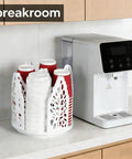 360 Degree Rotating Coffee Cup Holder With Four Compartments Lid Organizer next to coffee machine on countertop