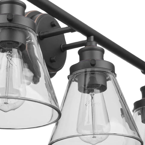 Close-up of oil rubbed bronze 3-light vanity fixture with clear glass shades, part of Oil Rubbed Bronze All In One Bathroom Set.