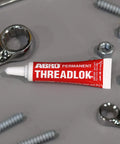 Heavy Duty Red Threadlocker High Strength Industrial Grade Adhesive Built For Automotive And Manufacturing Keeps Fasteners Tight Against Vibration And Heat Permanent Bond And High Temperature Resistance tube with bolts and wrenches